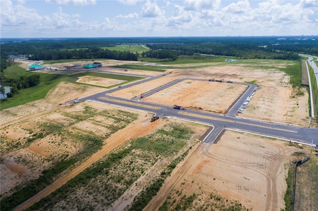 birds eye view of property with a rural view