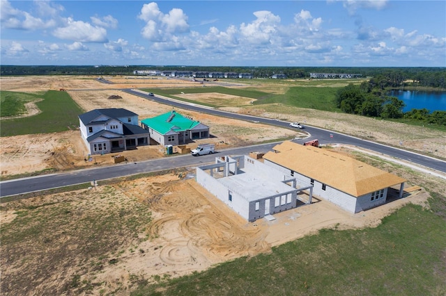 birds eye view of property with a water view and a rural view