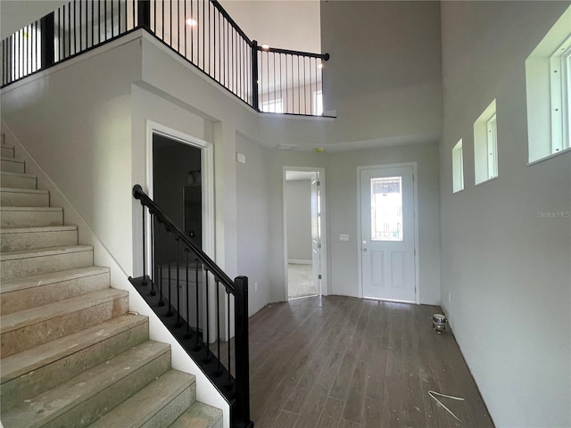 17505 Glossy Pomelo Way, Winter Garden, FL 34787 - entryway featuring wood finished floors, stairs, and a towering ceiling
