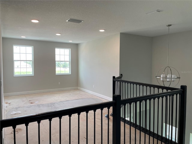 17505 Glossy Pomelo Way, Winter Garden, FL 34787 - spare room with a chandelier, recessed lighting, and a textured ceiling