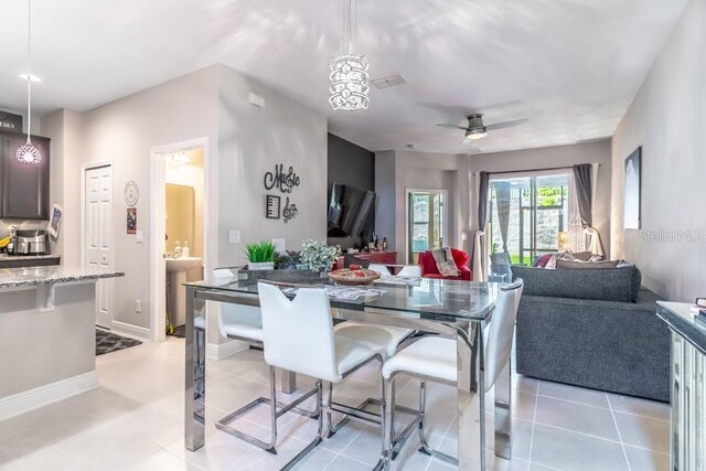 17437 Promenade Dr, Clermont, FL 34711 - dining room with ceiling fan and baseboards