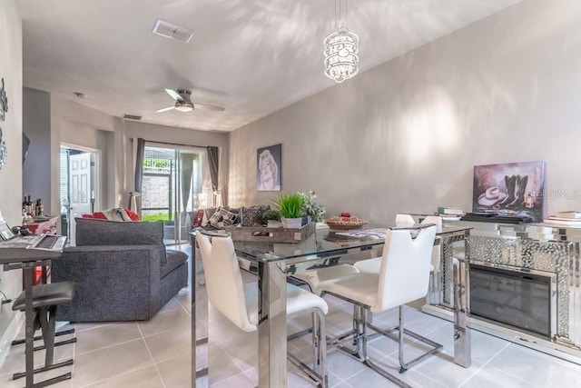 17437 Promenade Dr, Clermont, FL 34711 - dining room with light tile patterned floors and a ceiling fan