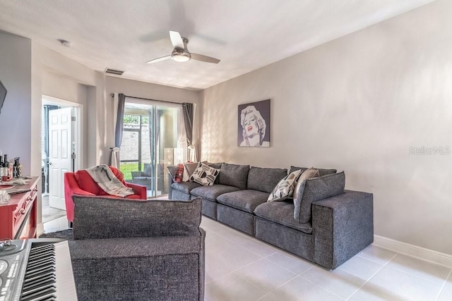 17437 Promenade Dr, Clermont, FL 34711 - living area with a ceiling fan and light tile patterned flooring