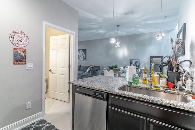 17437 Promenade Dr, Clermont, FL 34711 - kitchen with stainless steel dishwasher, a chandelier, light stone countertops, and light tile patterned floors
