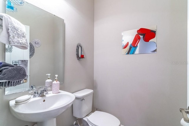 17437 Promenade Dr, Clermont, FL 34711 - bathroom featuring toilet and a sink