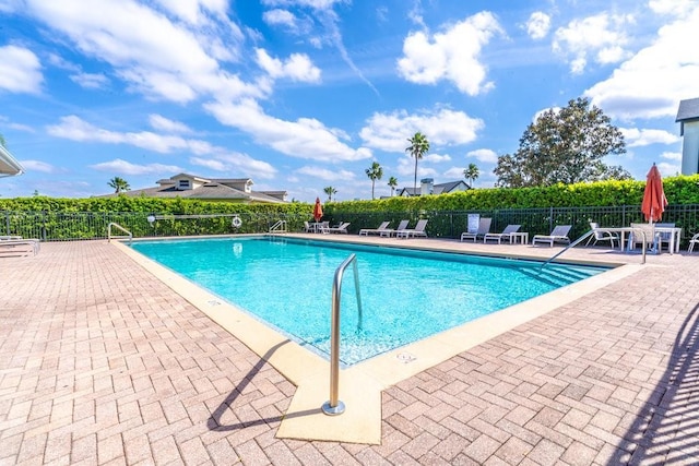 17437 Promenade Dr, Clermont, FL 34711 - community pool with a patio