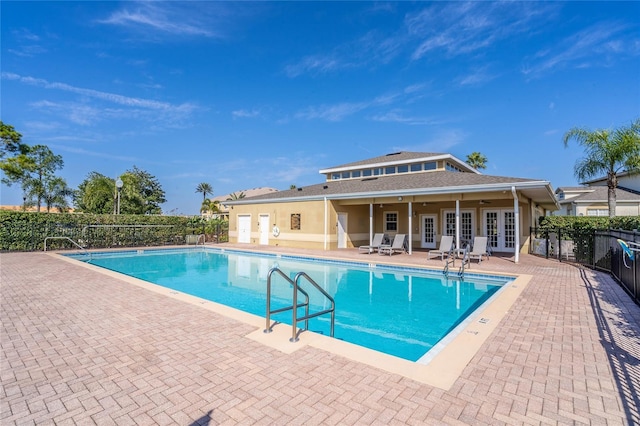 17437 Promenade Dr, Clermont, FL 34711 - community pool with french doors and a patio area