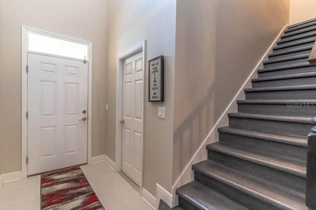 17437 Promenade Dr, Clermont, FL 34711 - foyer entrance featuring stairs and light tile patterned floors