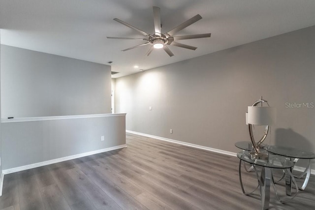 17437 Promenade Dr, Clermont, FL 34711 - spare room with a ceiling fan and wood finished floors