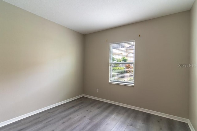 17437 Promenade Dr, Clermont, FL 34711 - unfurnished room featuring baseboards and wood finished floors