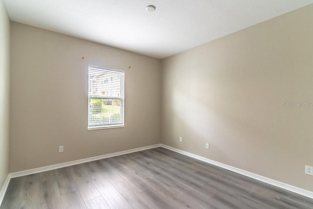 17437 Promenade Dr, Clermont, FL 34711 - spare room featuring wood finished floors and baseboards