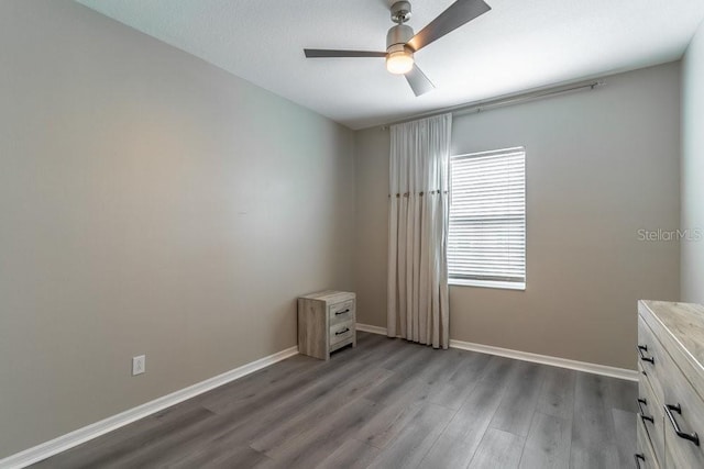 17437 Promenade Dr, Clermont, FL 34711 - unfurnished bedroom featuring wood finished floors and a ceiling fan