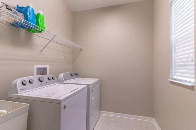 17437 Promenade Dr, Clermont, FL 34711 - washroom with washing machine and clothes dryer and tile patterned floors