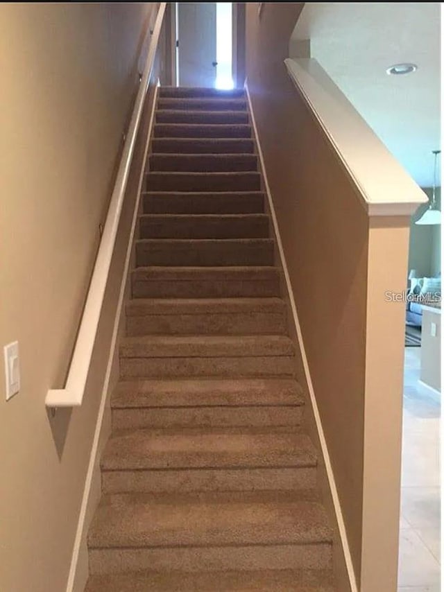1560 Chelsea Dr, Davenport, FL 33897 - stairway featuring baseboards