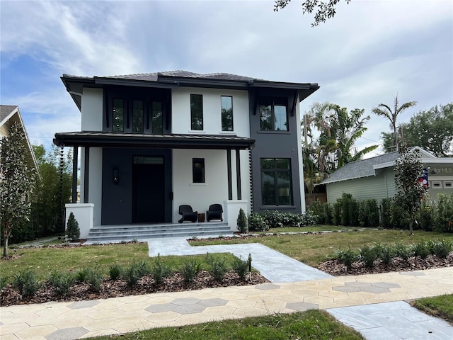 view of front of property with a front lawn and stucco siding