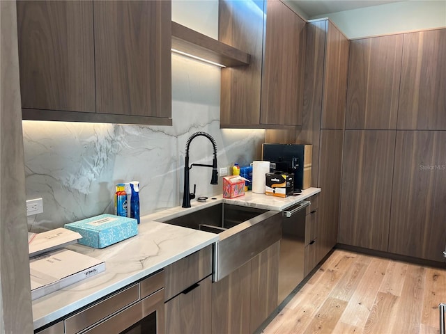 kitchen with light wood-style floors, modern cabinets, light stone counters, and open shelves