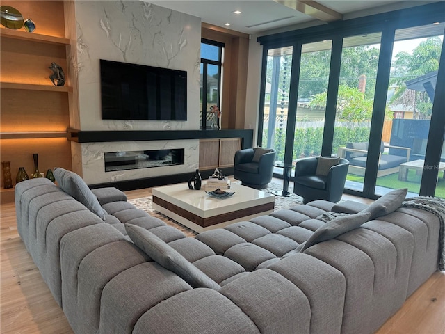 living room with recessed lighting and wood finished floors