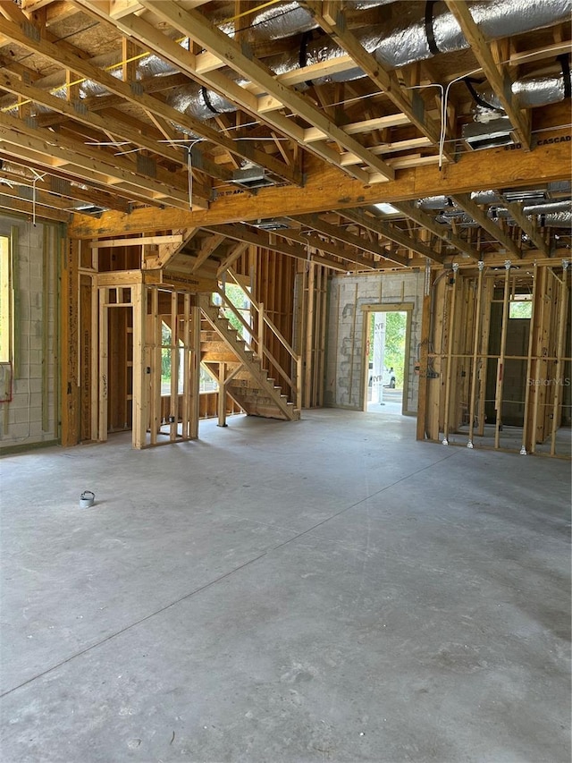166 Hammock Preserve Loop, Winter Garden, FL 34787 - misc room featuring unfinished concrete flooring and stairs