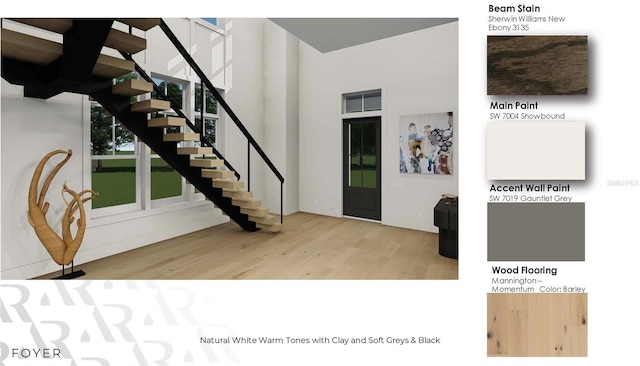 166 Hammock Preserve Loop, Winter Garden, FL 34787 - foyer featuring wood finished floors, stairway, and a towering ceiling