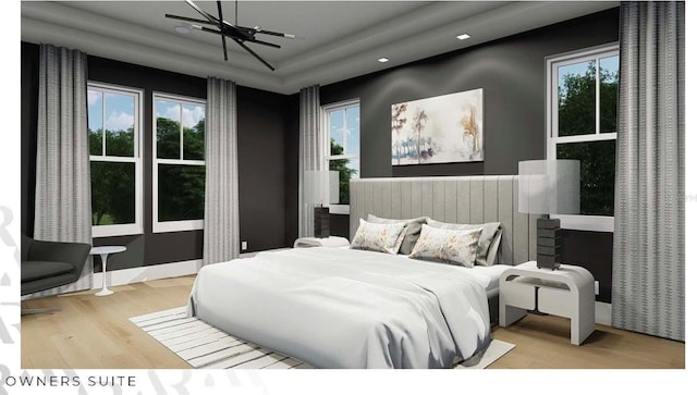 166 Hammock Preserve Loop, Winter Garden, FL 34787 - bedroom featuring wood finished floors, multiple windows, recessed lighting, and a tray ceiling