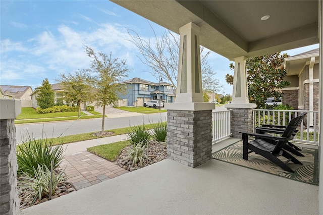 view of patio featuring a residential view and covered porch