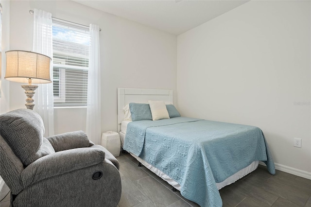 bedroom featuring baseboards