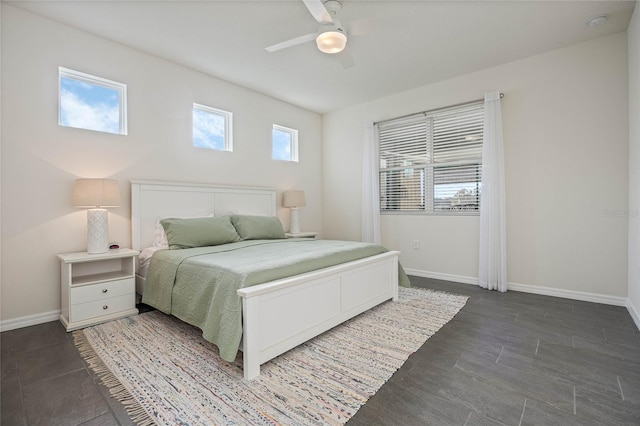 bedroom with baseboards and a ceiling fan