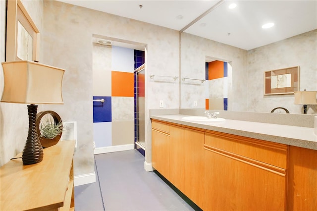 bathroom featuring baseboards, visible vents, concrete flooring, a sink, and recessed lighting