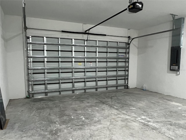 garage featuring electric panel and a garage door opener