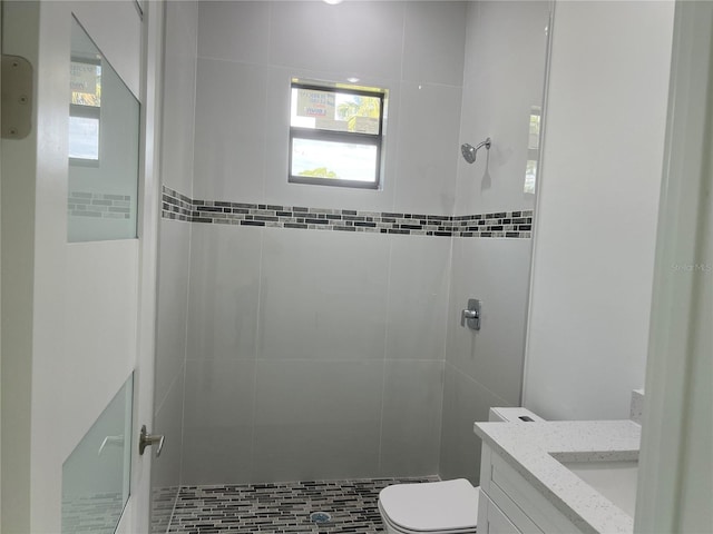 full bath with vanity, toilet, and a shower stall