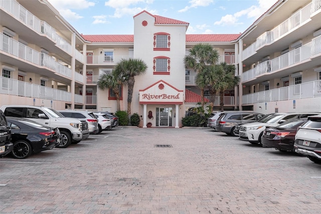 view of property featuring uncovered parking