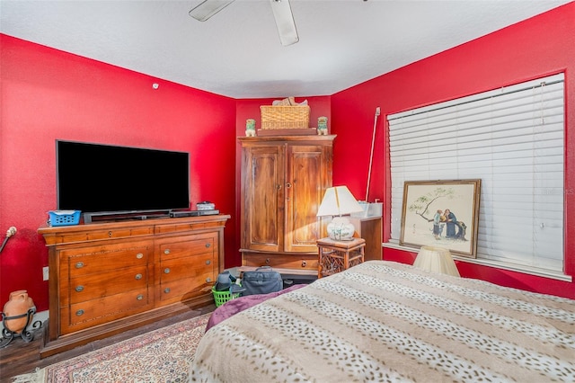 bedroom with ceiling fan and wood finished floors