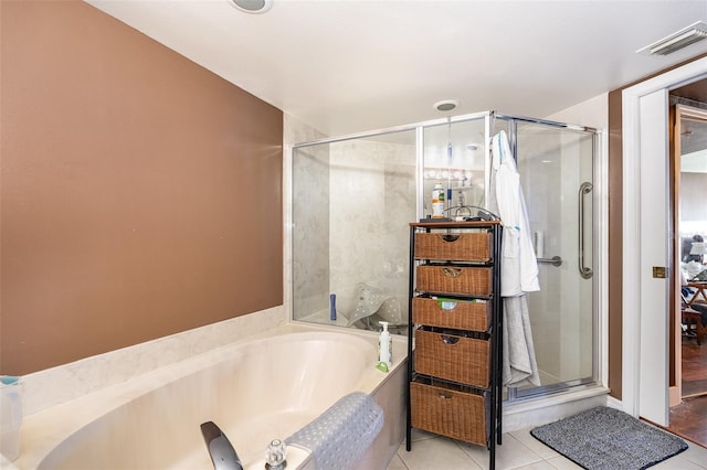 full bath featuring a stall shower, tile patterned floors, visible vents, and a bath