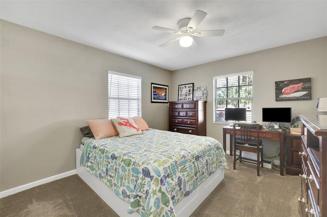 bedroom with carpet floors, multiple windows, a ceiling fan, and baseboards