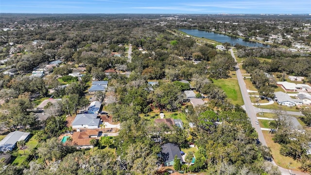 drone / aerial view with a water view and a residential view