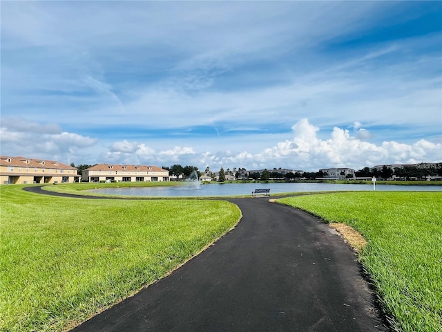 view of street with a residential view and a water view