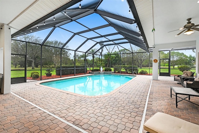 outdoor pool with a patio area and glass enclosure