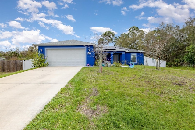 single story home featuring an attached garage, a front yard, fence, and roof mounted solar panels