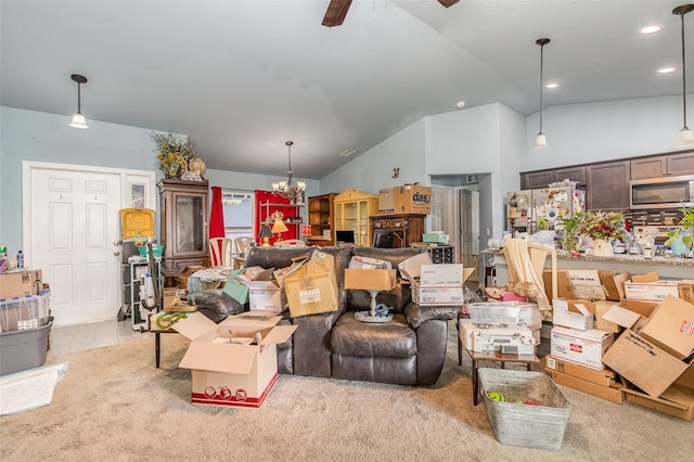 living area with recessed lighting, light carpet, vaulted ceiling, and ceiling fan with notable chandelier