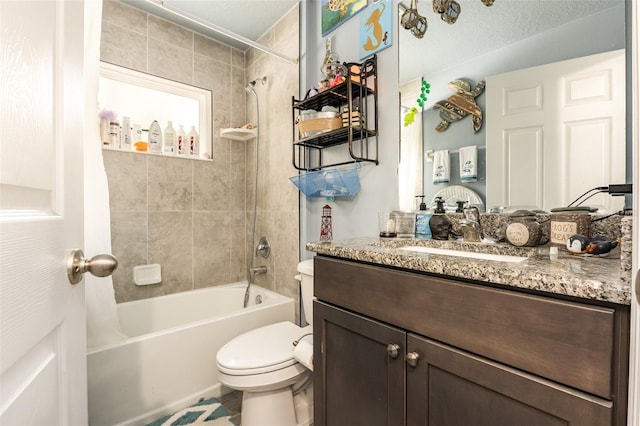 bathroom featuring shower / bathing tub combination, vanity, and toilet