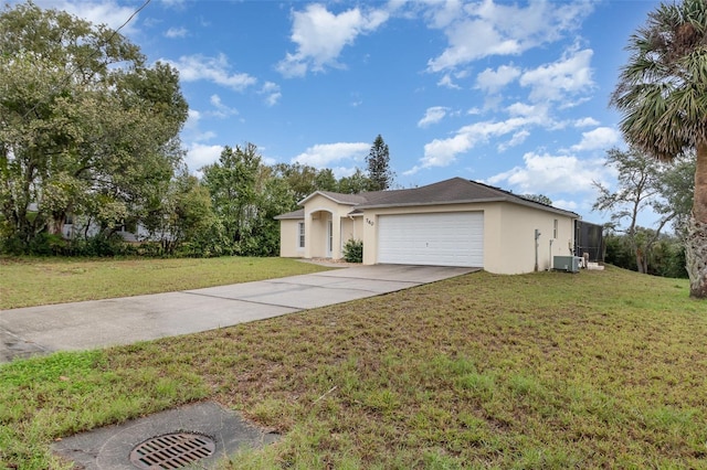 single story home featuring a front yard, central AC unit, driveway, an attached garage, and stucco siding