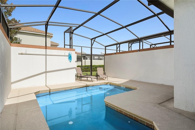 outdoor pool featuring a lanai and a patio area