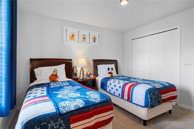 bedroom with a closet and carpet flooring