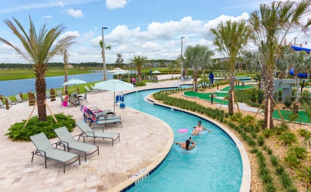 view of pool featuring a water view