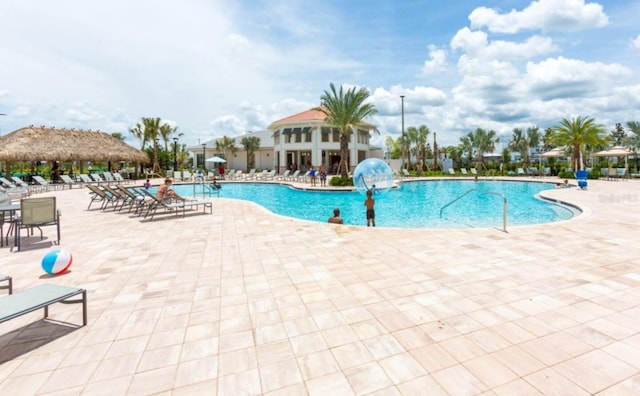 community pool with a patio