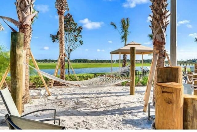 view of jungle gym with a water view