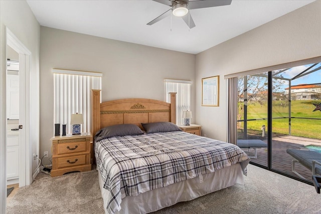 bedroom featuring carpet, access to outside, and a ceiling fan