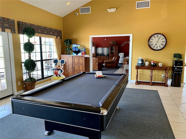 rec room featuring high vaulted ceiling, visible vents, and light tile patterned flooring