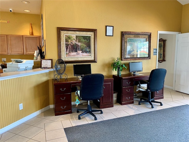 office with light tile patterned floors and baseboards