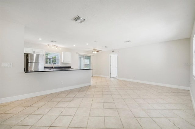 spare room featuring recessed lighting, visible vents, a sink, ceiling fan, and baseboards